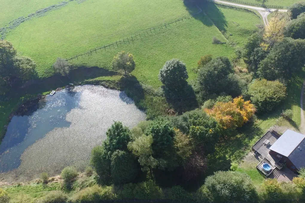 View of private lodge and pond