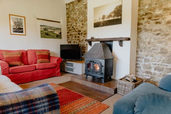 Wood burning stove in Weathervane Cottage