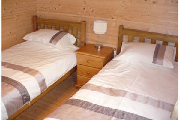 With two single beds, wardrobe and chest of drawers