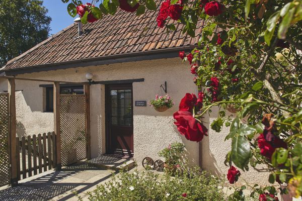 A pretty courtyard leads to the cottage
