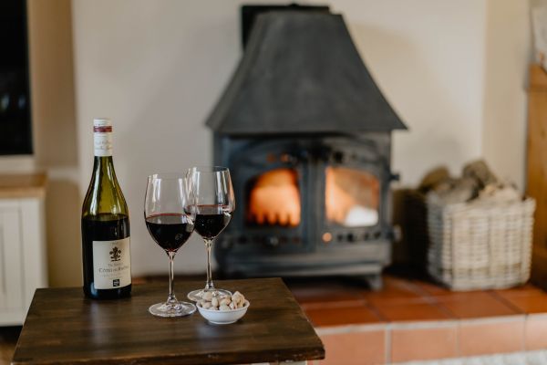 Relax in Garden Cottage around the wood burning stove