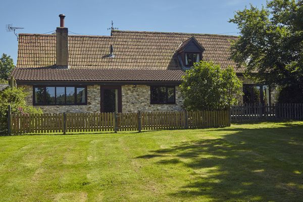 Meadow Cottage (right) nestles behind Weathervane Cottage (left)