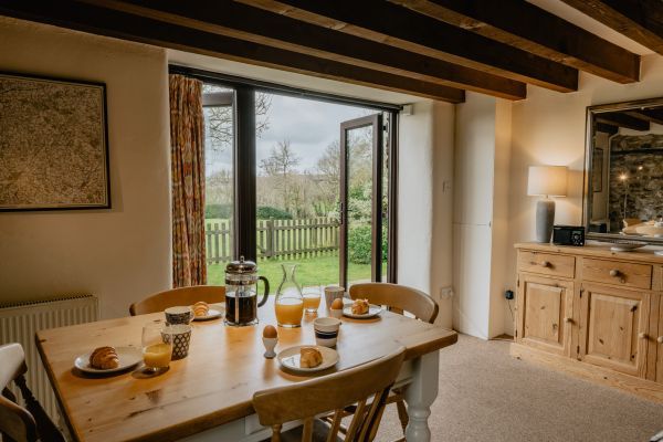 Doors open onto Meadow Cottage's private patio