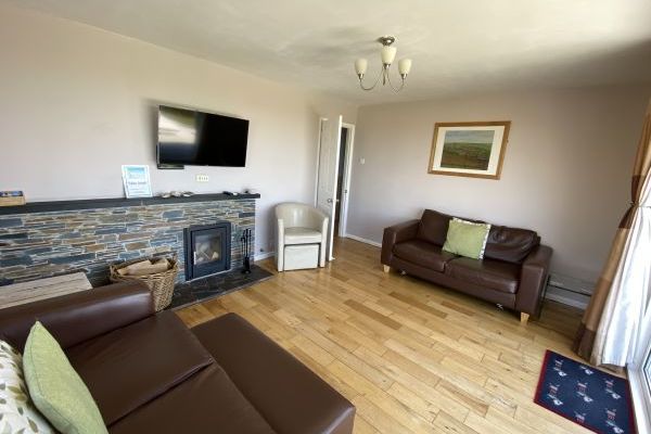 Lounge with patio doors and views of open countryside