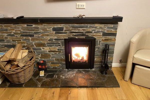 Roaring log burner fire at Tubbs Delight Holiday cottage in South Devon