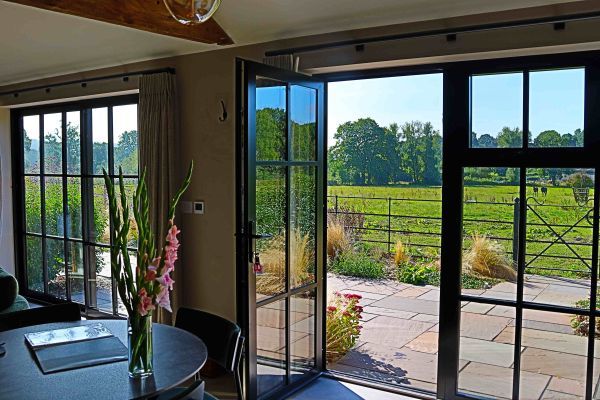 Field Barn sleeps 2, with a private Steam Room and AirCon!