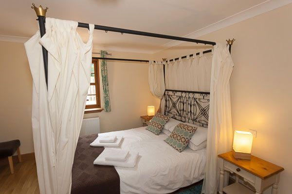 Romantic master bedroom at Rose Cottage